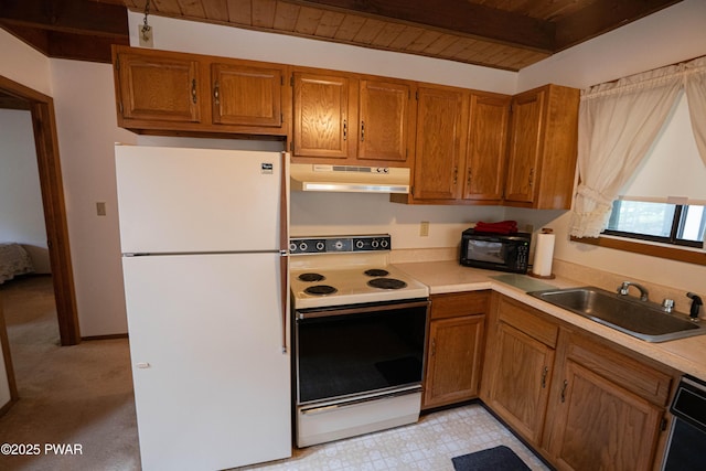 16 Par Ct, Lake Ariel, PA 18436 - kitchen featuring black appliances, under cabinet range hood, a sink, brown cabinets, and wood ceiling with exposed beams