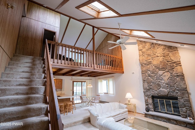 16 Par Ct, Lake Ariel, PA 18436 - living area featuring a skylight, a stone fireplace, stairs, ceiling fan, and high vaulted ceiling