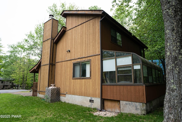 16 Par Ct, Lake Ariel, PA 18436 - view of property exterior with crawl space, a chimney, a yard, and a sunroom