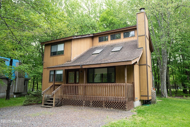 16 Par Ct, Lake Ariel, PA 18436 - chalet / cabin featuring a porch, a chimney, and roof with shingles