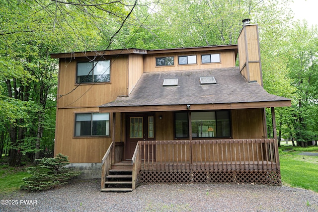 16 Par Ct, Lake Ariel, PA 18436 - chalet / cabin with a chimney, roof with shingles, and covered porch