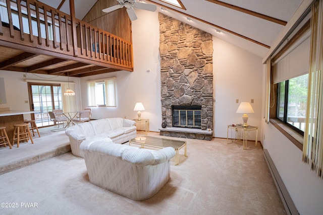 16 Par Ct, Lake Ariel, PA 18436 - living area with carpet flooring, beamed ceiling, ceiling fan, a stone fireplace, and high vaulted ceiling