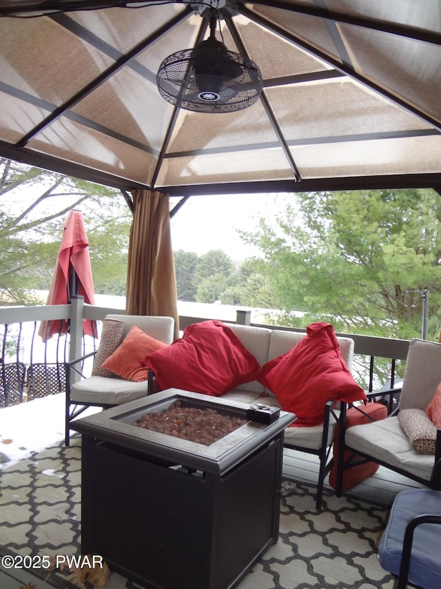 view of patio / terrace featuring a gazebo and a fire pit