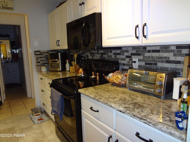 kitchen with white cabinetry, tasteful backsplash, and black appliances