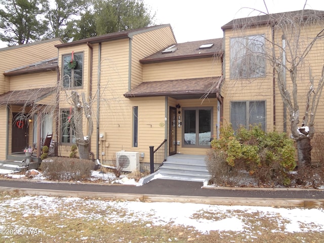 view of front of home featuring ac unit