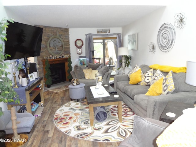 living room featuring hardwood / wood-style floors and a fireplace