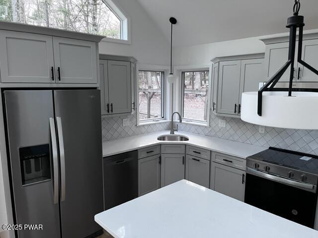 104 Maple Park Dr, Shohola, PA 18458 - kitchen featuring stainless steel appliances, gray cabinetry, light countertops, healthy amount of natural light, and lofted ceiling