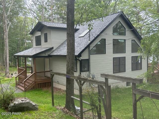 104 Maple Park Dr, Shohola, PA 18458 - back of property with roof with shingles and a yard