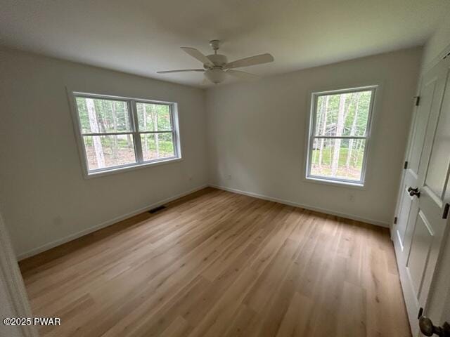 104 Maple Park Dr, Shohola, PA 18458 - empty room with light wood-type flooring and a ceiling fan