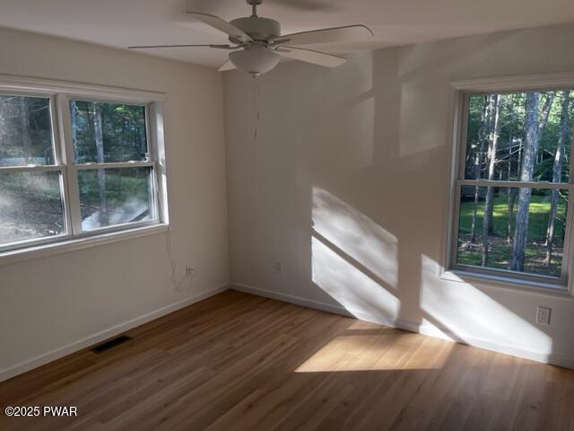 104 Maple Park Dr, Shohola, PA 18458 - spare room featuring a ceiling fan and wood finished floors