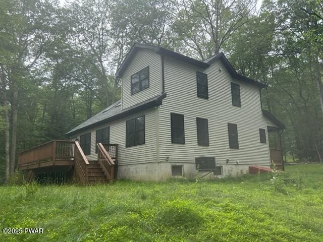 104 Maple Park Dr, Shohola, PA 18458 - rear view of house featuring a wooden deck and a yard