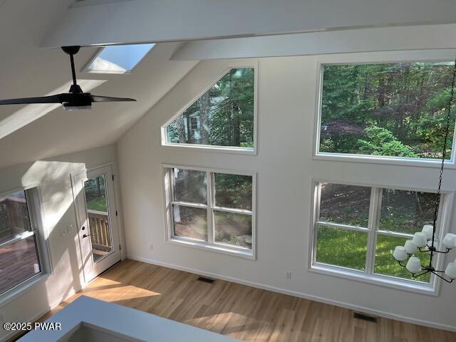 104 Maple Park Dr, Shohola, PA 18458 - additional living space with wood finished floors, ceiling fan, and vaulted ceiling