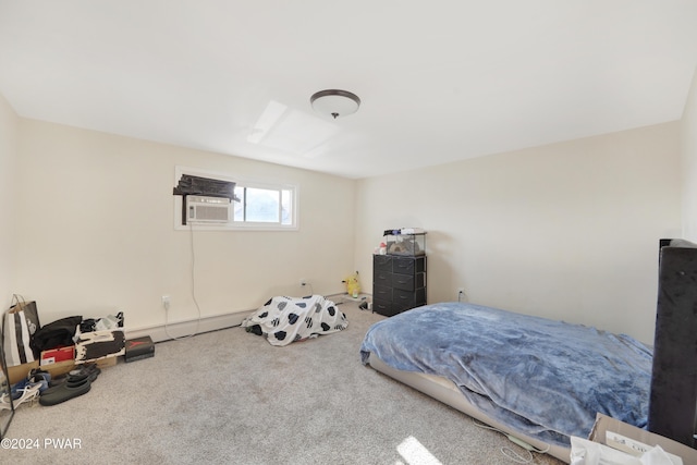 bedroom with carpet, cooling unit, and a baseboard heating unit