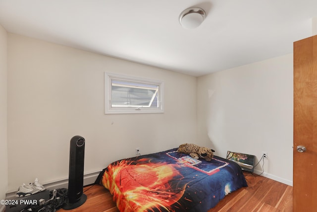 bedroom with wood-type flooring