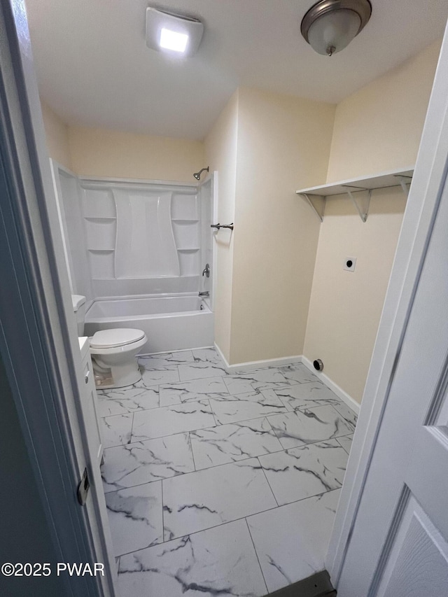 full bathroom with marble finish floor, shower / bath combination, toilet, and baseboards