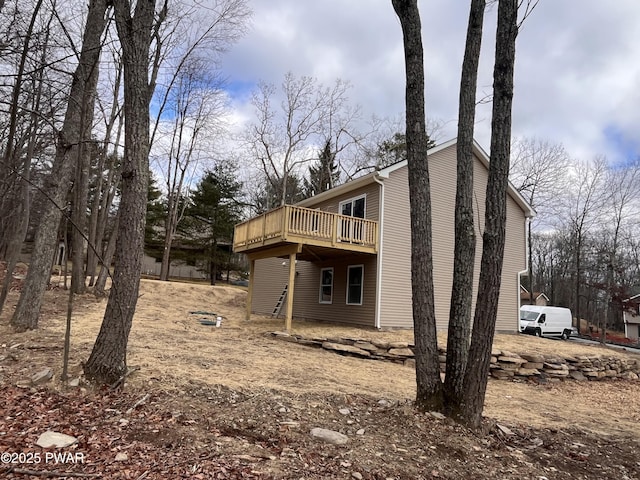 view of property exterior featuring a deck