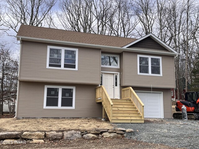 bi-level home featuring a garage