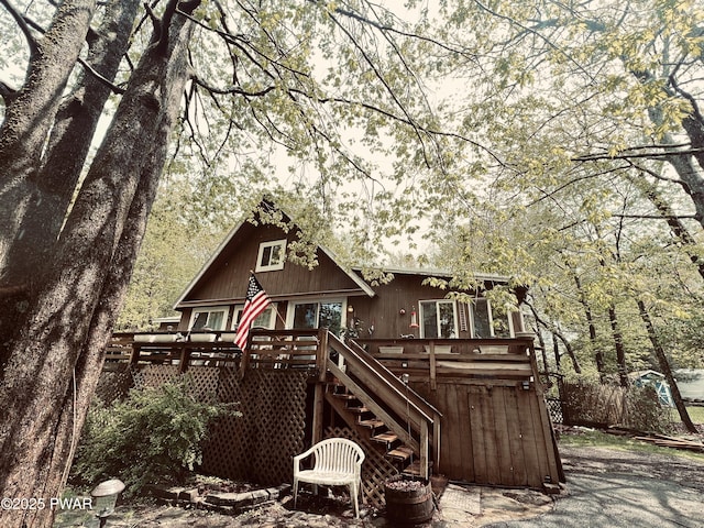 124 Roundhill Rd, Dingmans Ferry, PA 18328 - back of property featuring a deck and stairway