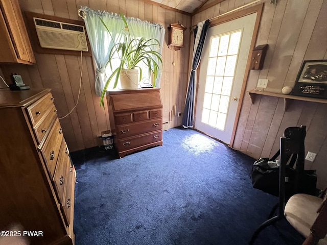 124 Roundhill Rd, Dingmans Ferry, PA 18328 - sitting room featuring wood walls, a wall mounted air conditioner, and carpet floors