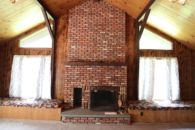 44 Purdytown Tpke, Lake Ariel, PA 18436 - carpeted living room with lofted ceiling, a fireplace, plenty of natural light, wooden ceiling, and wood walls
