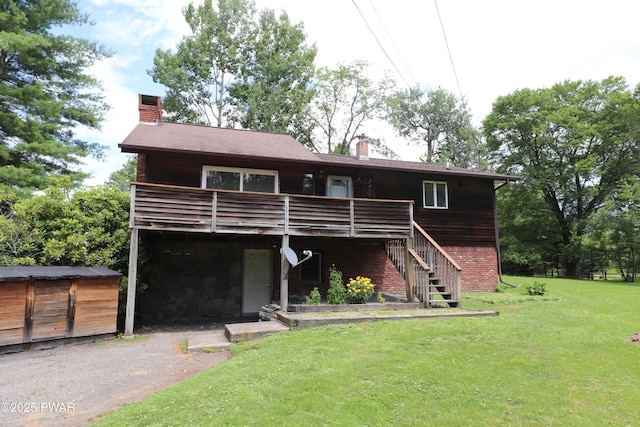 44 Purdytown Tpke, Lake Ariel, PA 18436 - rear view of house featuring a chimney, a deck, a lawn, and stairs