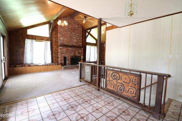44 Purdytown Tpke, Lake Ariel, PA 18436 - unfurnished living room with healthy amount of natural light, carpet flooring, a fireplace, tile patterned floors, and wood walls