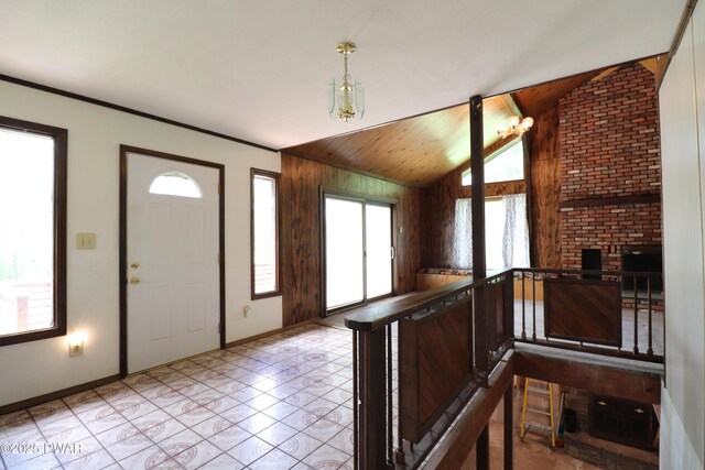 44 Purdytown Tpke, Lake Ariel, PA 18436 - entrance foyer with a chandelier, plenty of natural light, vaulted ceiling, wood walls, and wooden ceiling