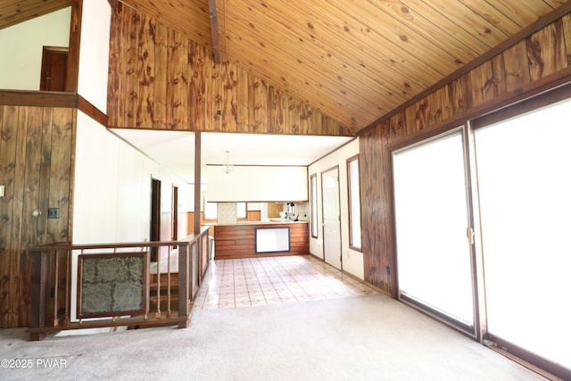 44 Purdytown Tpke, Lake Ariel, PA 18436 - unfurnished living room with lofted ceiling, carpet floors, wooden walls, and wood ceiling