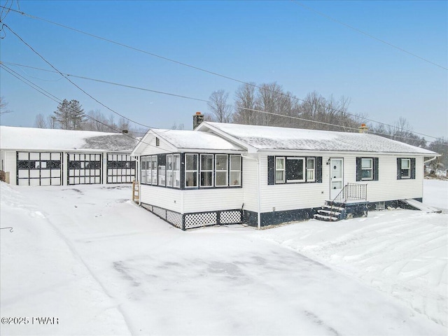 view of front of home with a sunroom