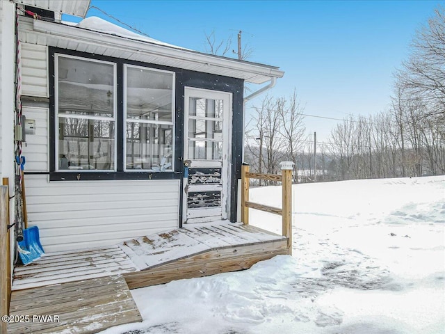 view of snow covered property entrance