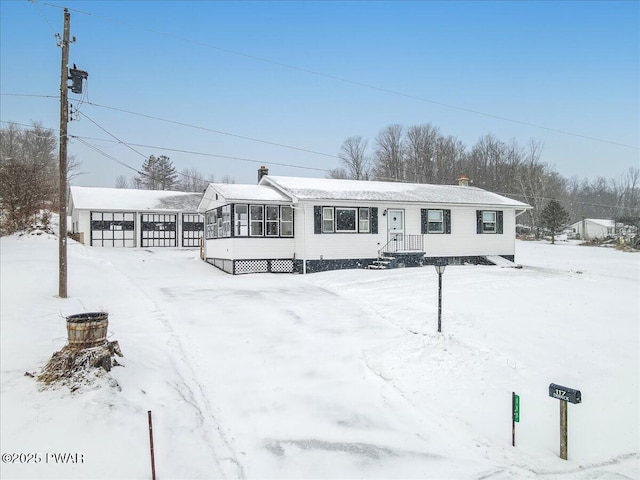 view of front of property featuring a sunroom