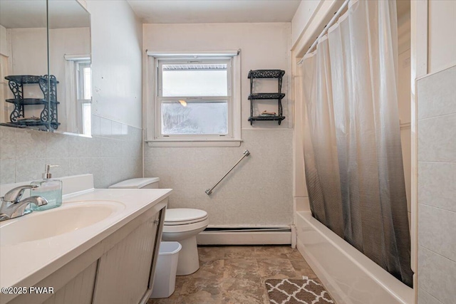 full bathroom featuring tile walls, vanity, shower / bath combination with curtain, a baseboard radiator, and toilet