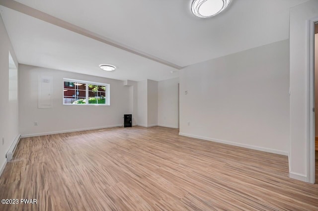 1202 Wallenpaupack Dr, Lake Ariel, PA 18436 - empty room with a baseboard radiator, light wood-style flooring, and baseboards