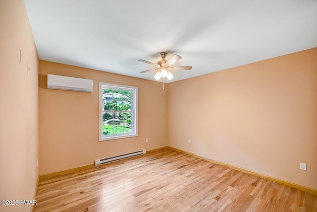 spare room with a wall unit AC, ceiling fan, a baseboard radiator, and light wood-type flooring