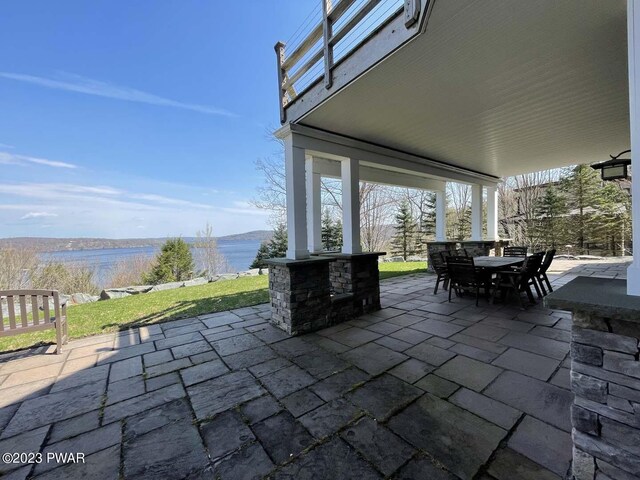 view of patio / terrace with a water view