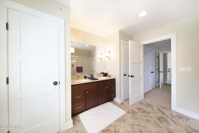 bathroom with vanity and an enclosed shower