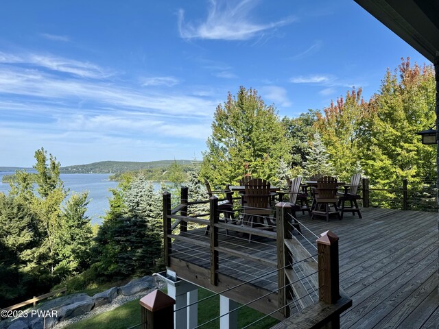 wooden deck with a water view