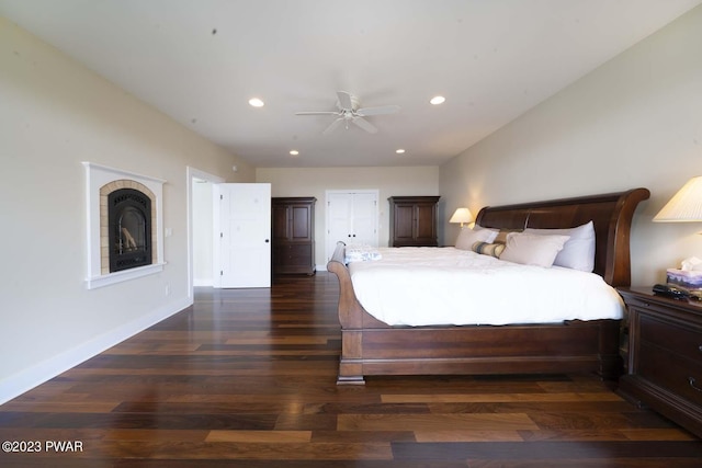 bedroom featuring ceiling fan and dark wood-type flooring