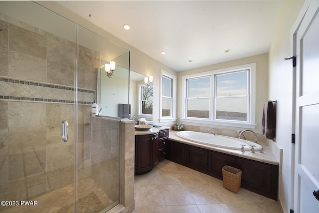 bathroom featuring tile patterned floors, vanity, and independent shower and bath