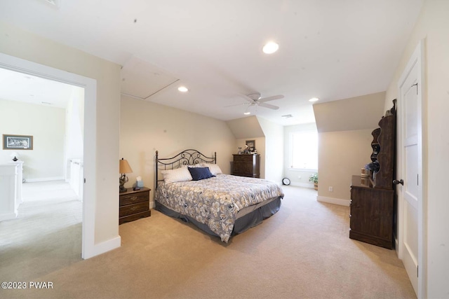 bedroom featuring ceiling fan, light colored carpet, and vaulted ceiling