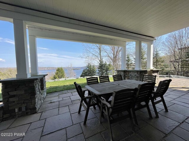 view of patio featuring a water view