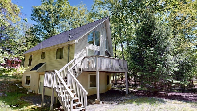 216 Westfall Dr, Dingmans Ferry, PA 18328 - back of property featuring stairs, a deck, and a shingled roof