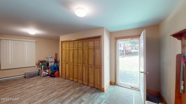 216 Westfall Dr, Dingmans Ferry, PA 18328 - recreation room with wood finished floors, baseboard heating, and baseboards