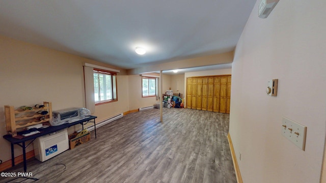216 Westfall Dr, Dingmans Ferry, PA 18328 - misc room featuring a baseboard radiator, wood finished floors, and baseboards
