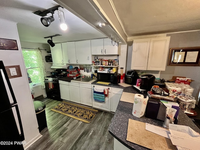 kitchen with white cabinets, sink, dark hardwood / wood-style floors, and black appliances