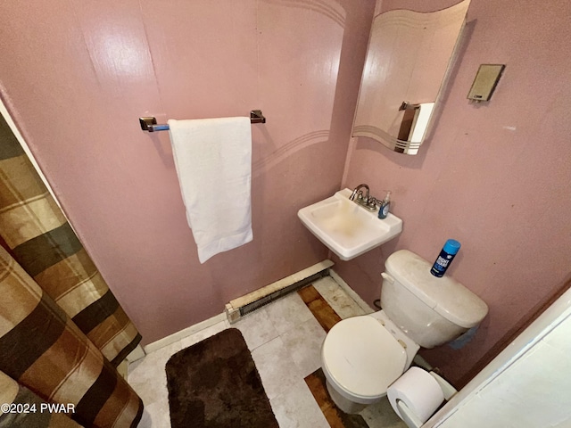 bathroom featuring toilet and sink