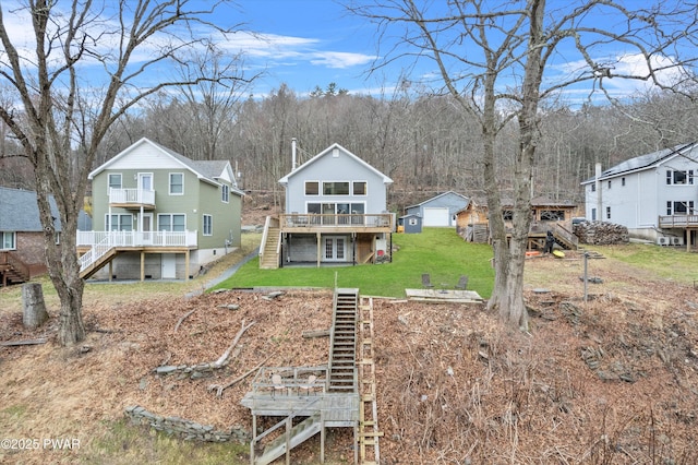 111 Riverbend Ln, Beach Lake, PA 18405 - back of property with stairs, a deck, and a lawn