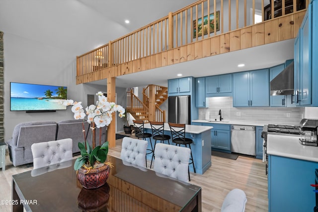 111 Riverbend Ln, Beach Lake, PA 18405 - interior space with recessed lighting, stairs, light wood-style flooring, and a high ceiling