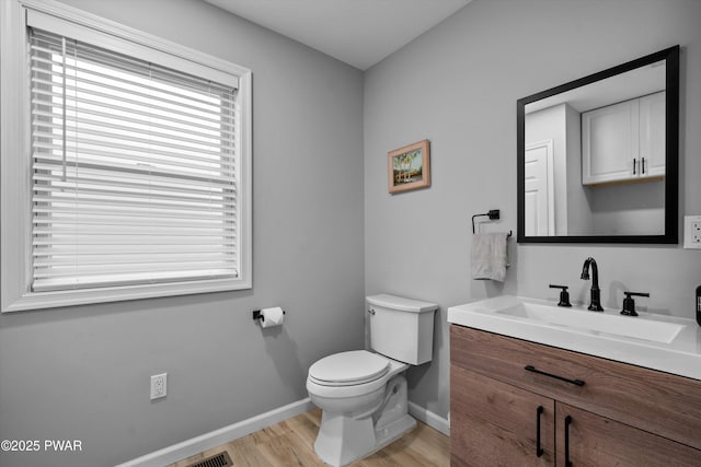111 Riverbend Ln, Beach Lake, PA 18405 - bathroom featuring toilet, wood finished floors, vanity, and baseboards