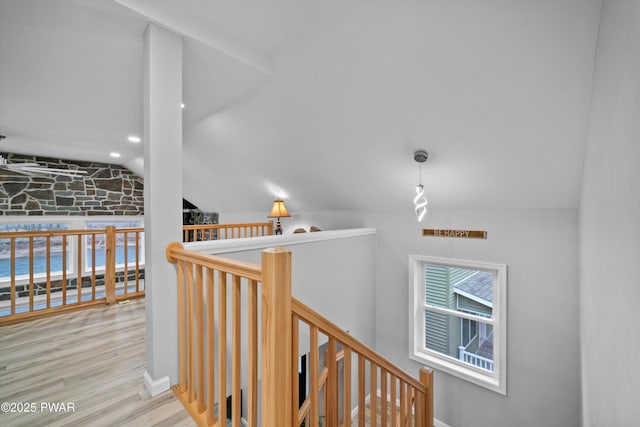 111 Riverbend Ln, Beach Lake, PA 18405 - hall with wood finished floors, vaulted ceiling, and an upstairs landing